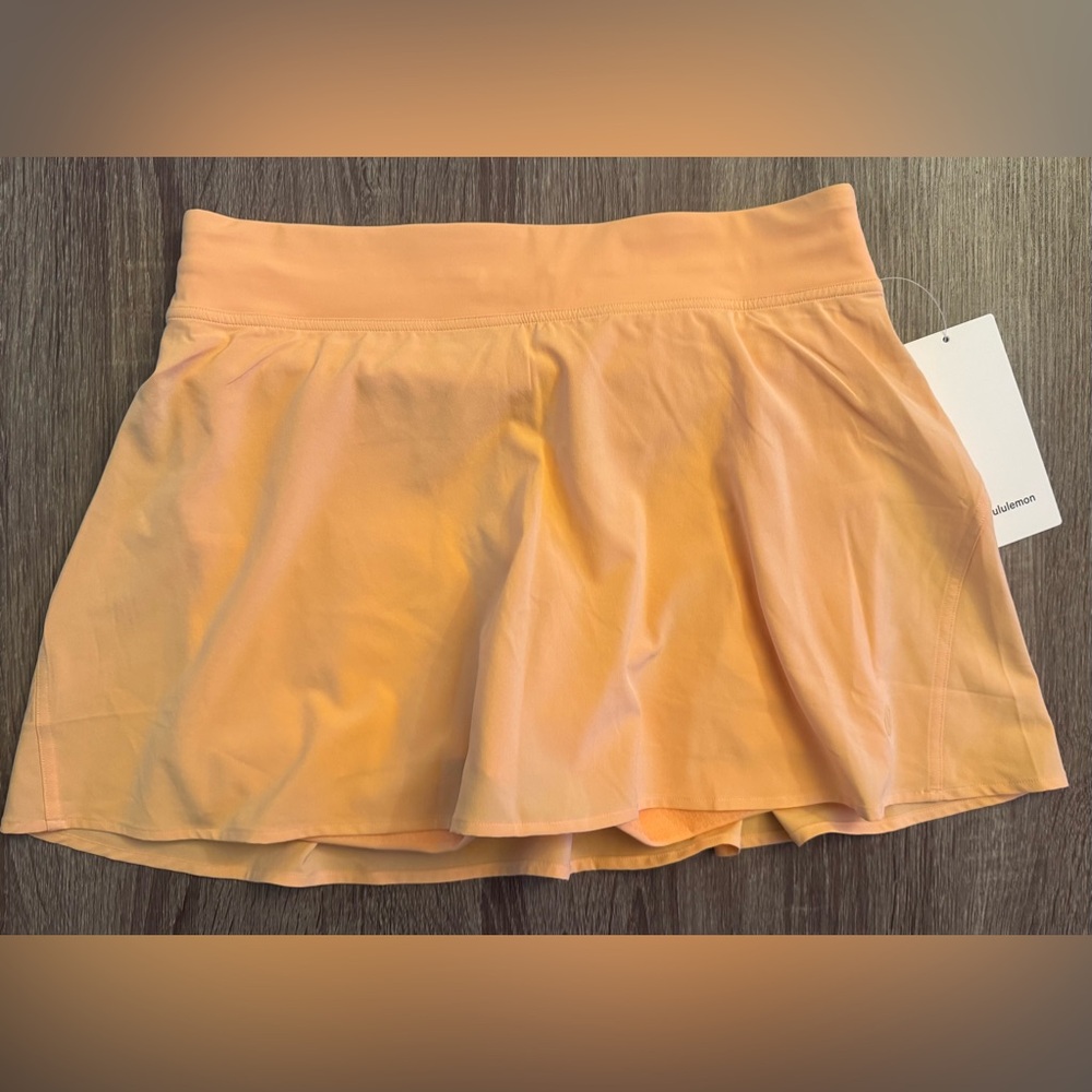 NWT Lululemon Lightweight High Rise Tennis Skirt. Rock Melon. Peach tone.Size 10